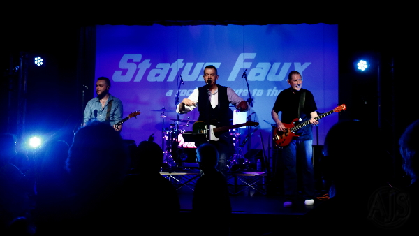 The band on stage looking out into the audience.