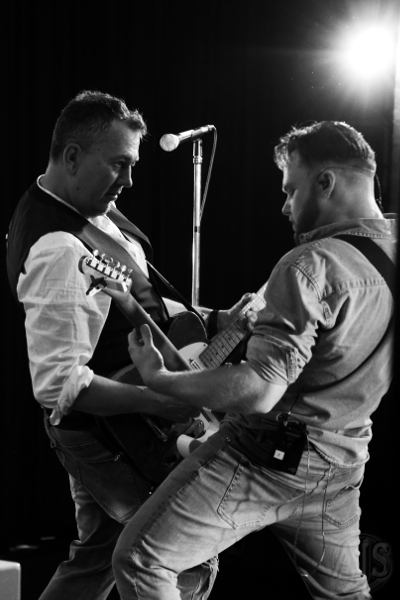 Two duelling guitarists.